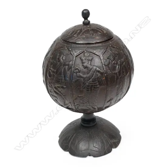 An antique Indonesian carved lidded coconut vessel,