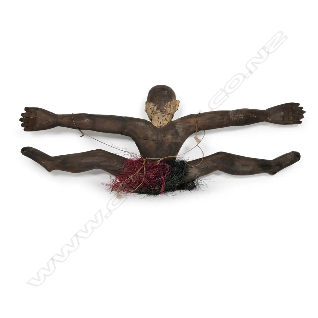 A PNG Sepik River food hook in the shape of a figure with outstretched limbs, Image 1++