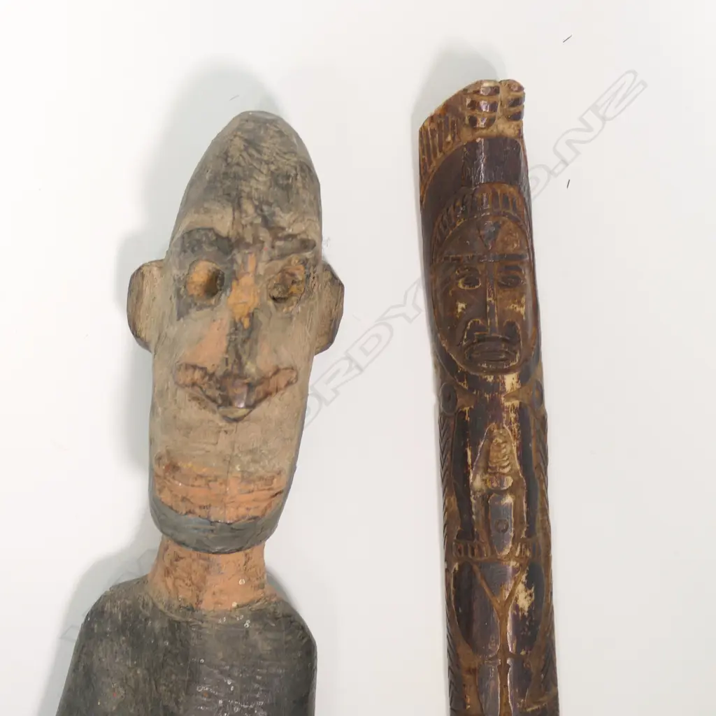 A PNG early 20thC carved Cassowary Bird bone dagger and a carved Sepik River male figure, Image 1++