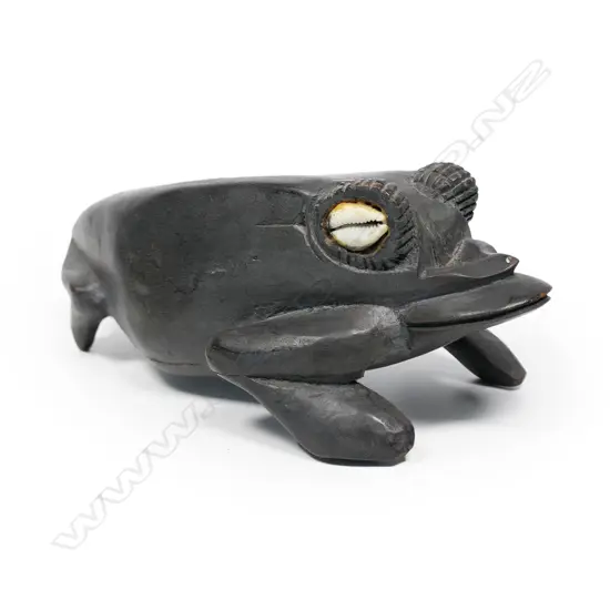 A carved PNG wooden frog figure,