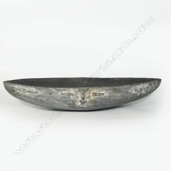 A large PNG wooden boat shaped food bowl,