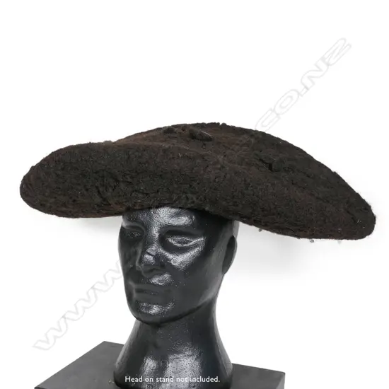 A PNG woven human hair conical headpiece,