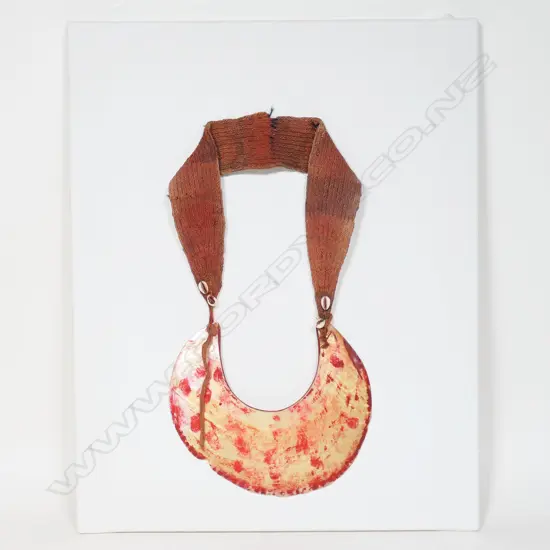Large kina shell with red ochre and red fibre strap necklace,