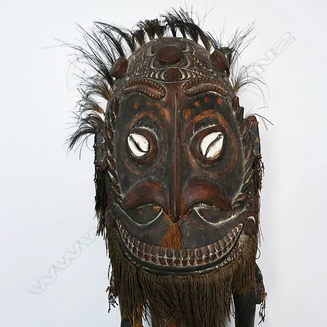 A PNG Orator figure on a stool with supporting figures, Image 1++