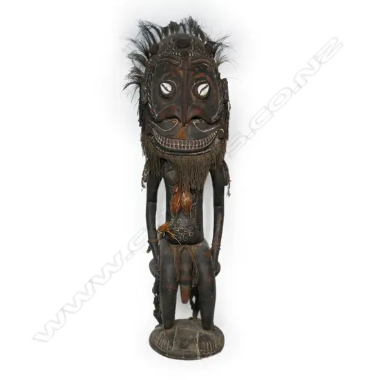 A PNG Orator figure on a stool with supporting figures,