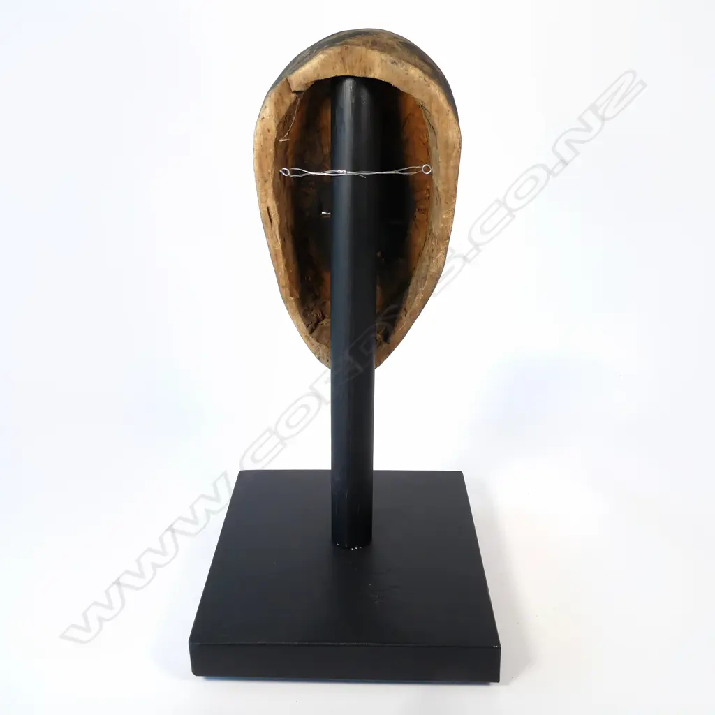 A Congolese light wooden face mask on stand, Image 1++