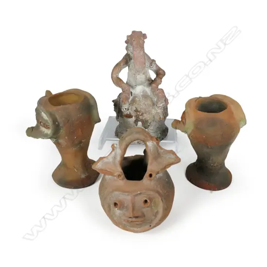 Four archaic style terracotta face pots,
