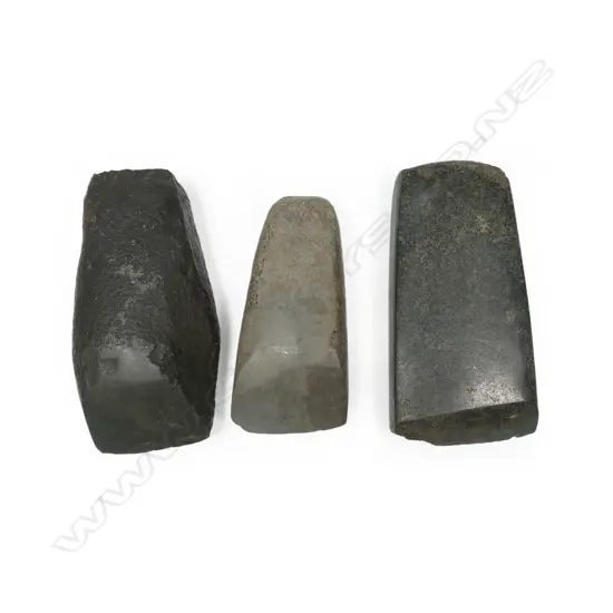 Three small stone adzes,