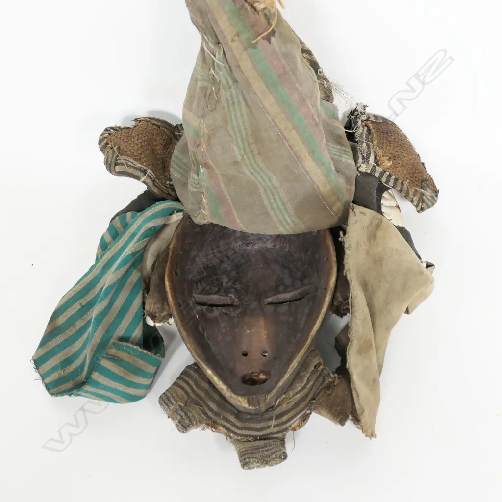 An African face mask with handsewn fabric headgear, Image 1++