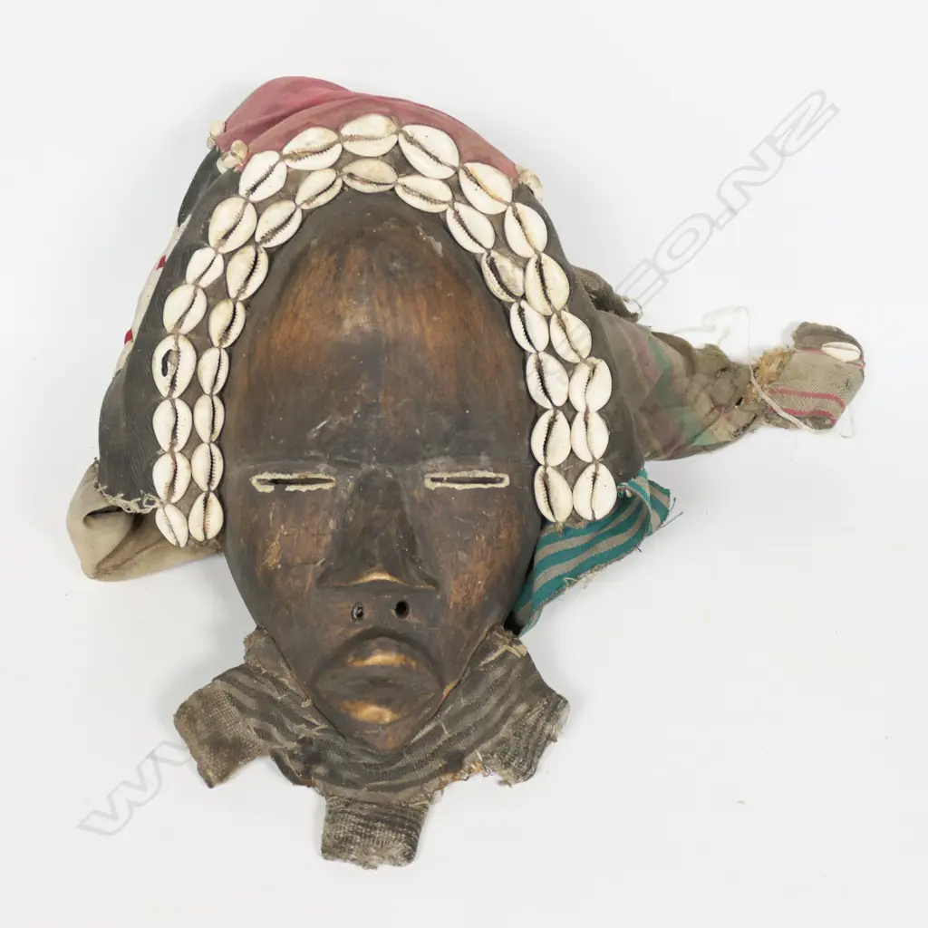 An African face mask with handsewn fabric headgear, Image 1++