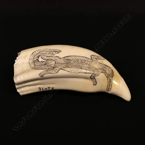 A contemporary scrimshaw whale tooth by Jorgen Lotz