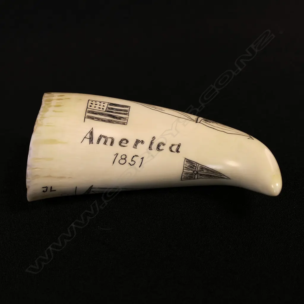 A small contemporary scrimshaw whale tooth Image 1++