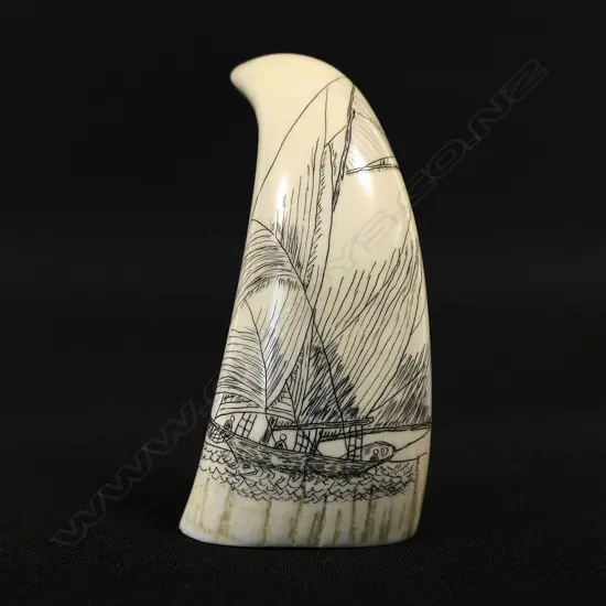 A small contemporary scrimshaw whale tooth