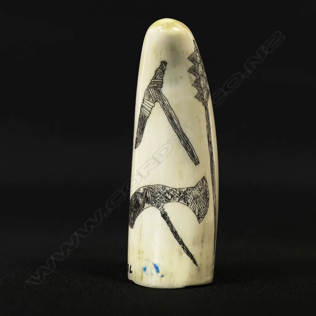 A small contemporary scrimshaw whale tooth Image 1++