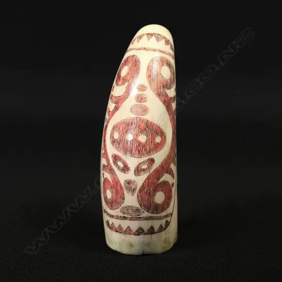 A small contemporary scrimshaw whale tooth