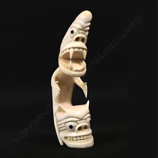 An Inuit culture sperm whale tooth Tupilak (tupilaq) carving