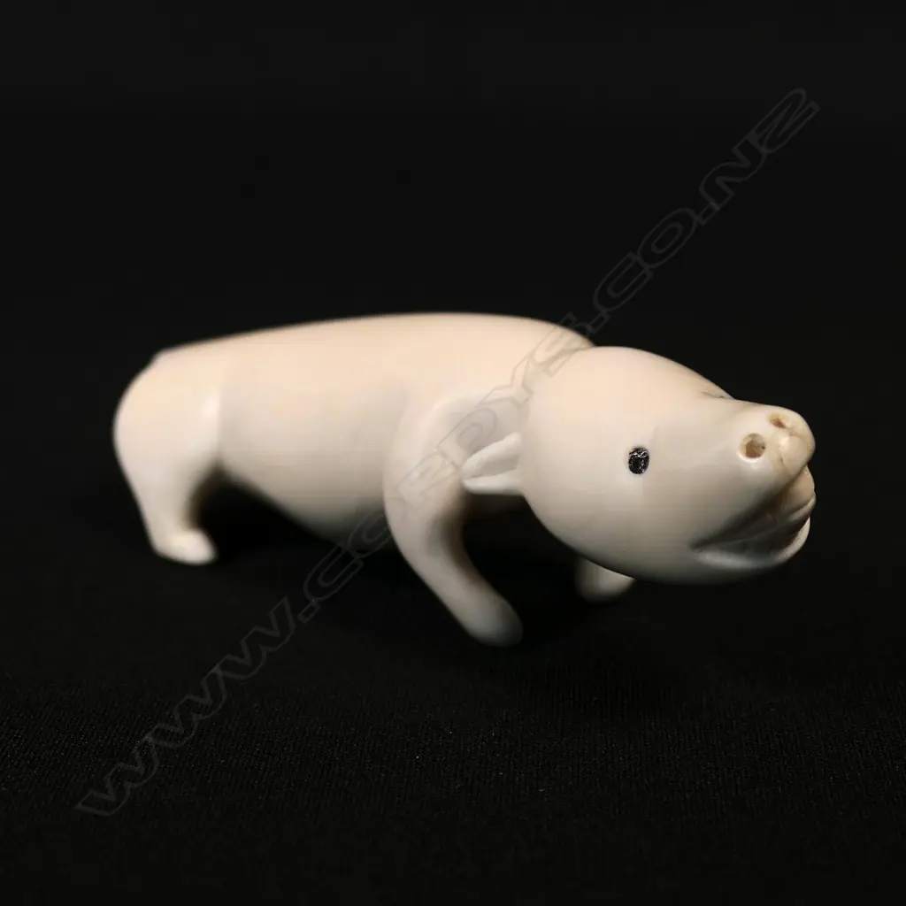 An Inuit culture marine ivory carving of a dog Image 1++
