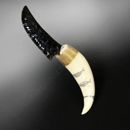 A scrimshaw whale tooth handled knife with a knapped glass blade by Jorgen Lotz