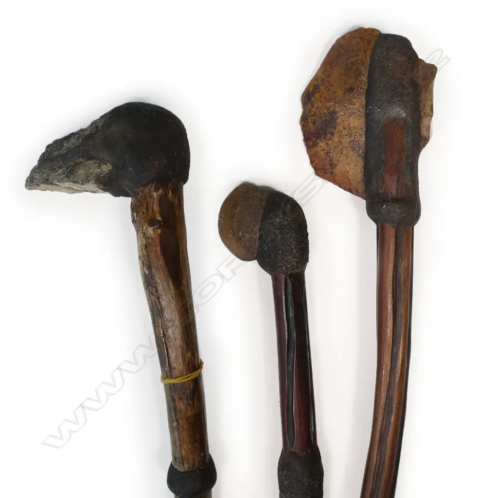 An Aboriginal stone fighting pick and two stone headed axes Image 1++