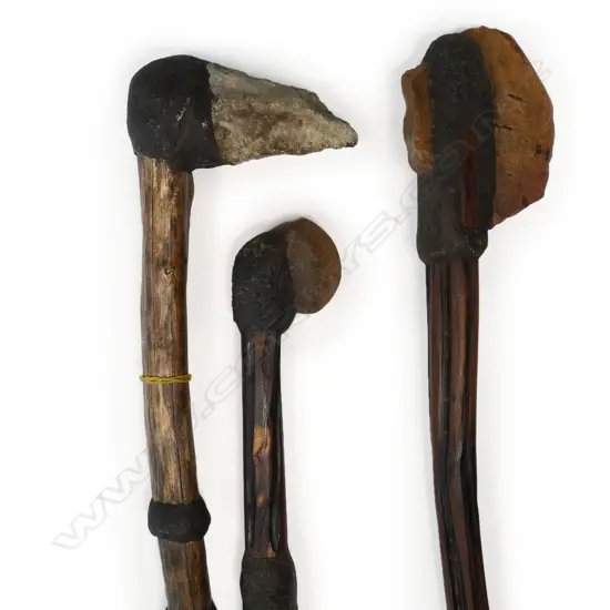 An Aboriginal stone fighting pick and two stone headed axes