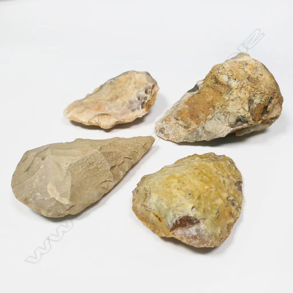 Four Neolithic flaked stone tools, three with location inscribed. 'Dchira, Mauritanien 300,000 AR' (Western Sahara); 'La Guerche' (Indre-et-Loire, France); 'El Mekta 6 (Settat, Morocco); the fourth unnamed but described on sale in 2013 as 'Upper Paleolithic Flint, Abbevillian bifacial, amigdala' from Saharan Sudan (El-Fasher)'. Longest 120mm. Provenance: The Jorgen Lotz Collection. Image 1++