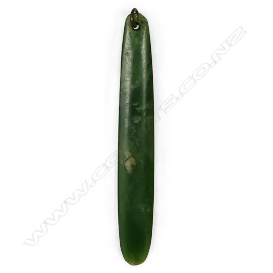A large old Māori pounamu kuru pendant