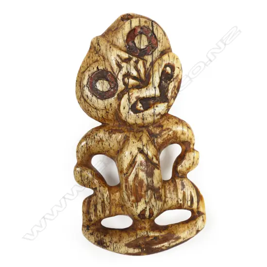 A rare and large old Māori carved paraoa (whalebone) hei tiki