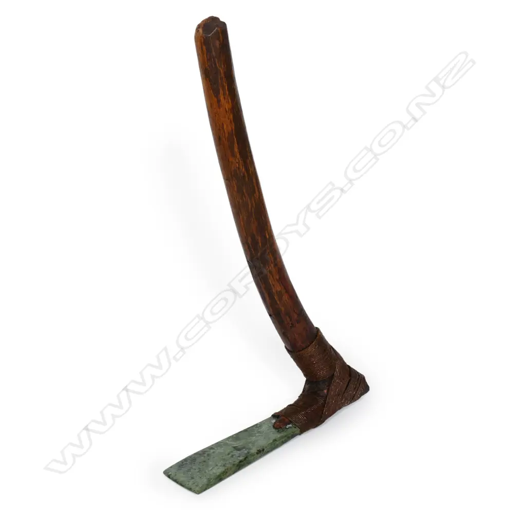 A tribal pounamu and carved wood hafted adze Image 1++