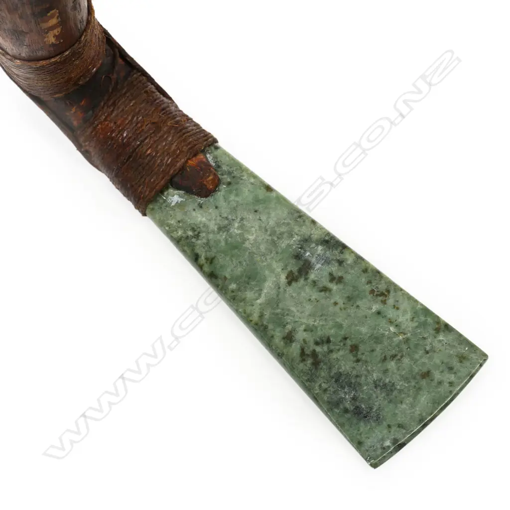 A tribal pounamu and carved wood hafted adze Image 1++
