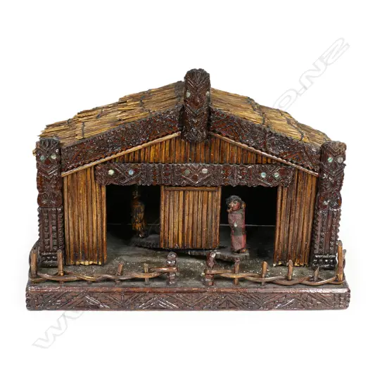 An early 20thC carved and constructed Māori model whare weather indicator