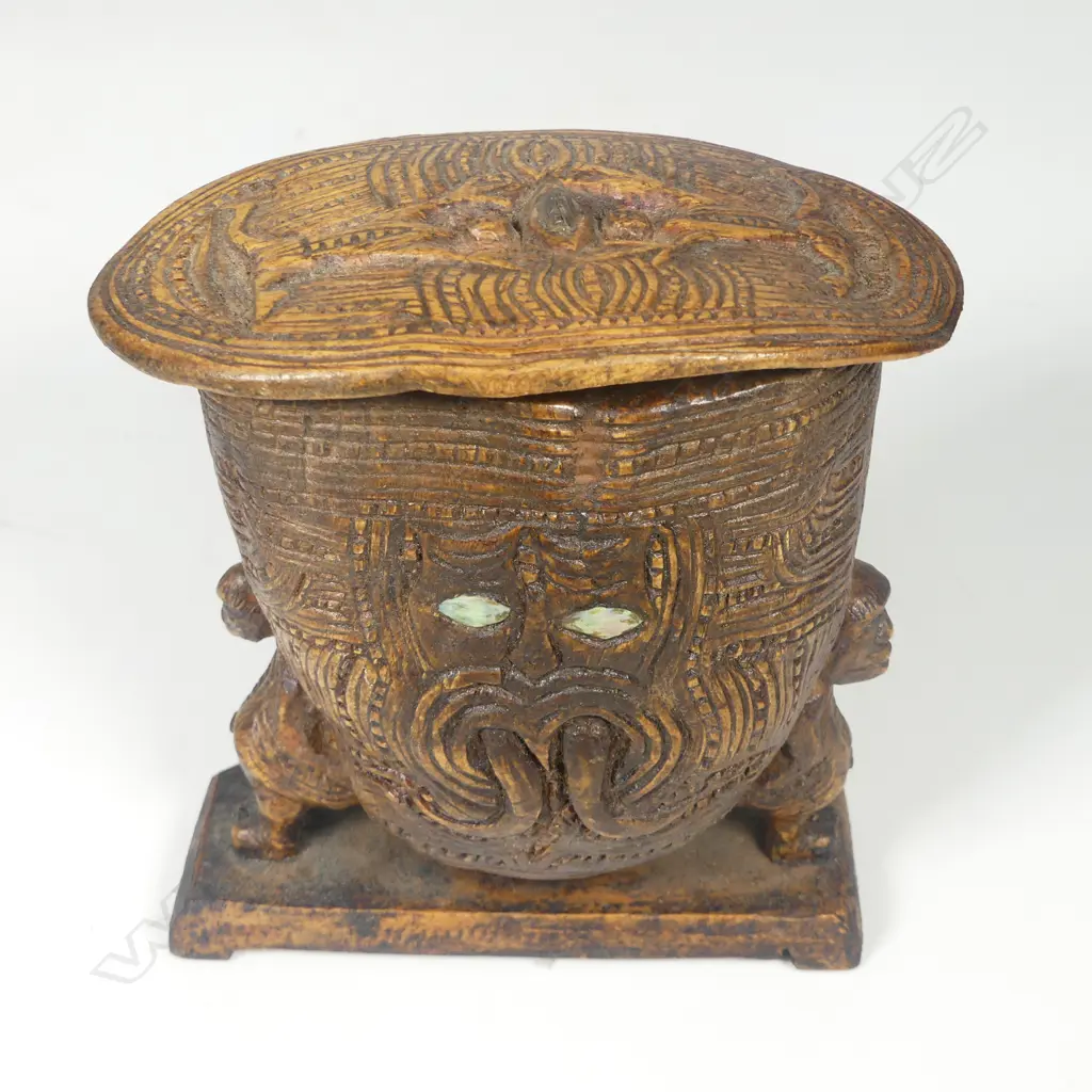 An old Māori carved wooden small figure supported lidded box Image 1++