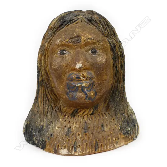 A carved kauri gum Māori portrait bust of a woman
