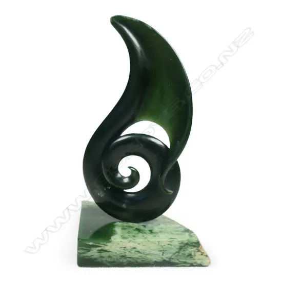Donn Salt carved kawakawa pounamu koru on stand