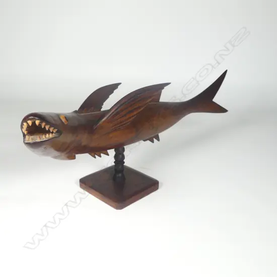 A good old Pitcairn Island carved dark hardwood flying fish sculpture