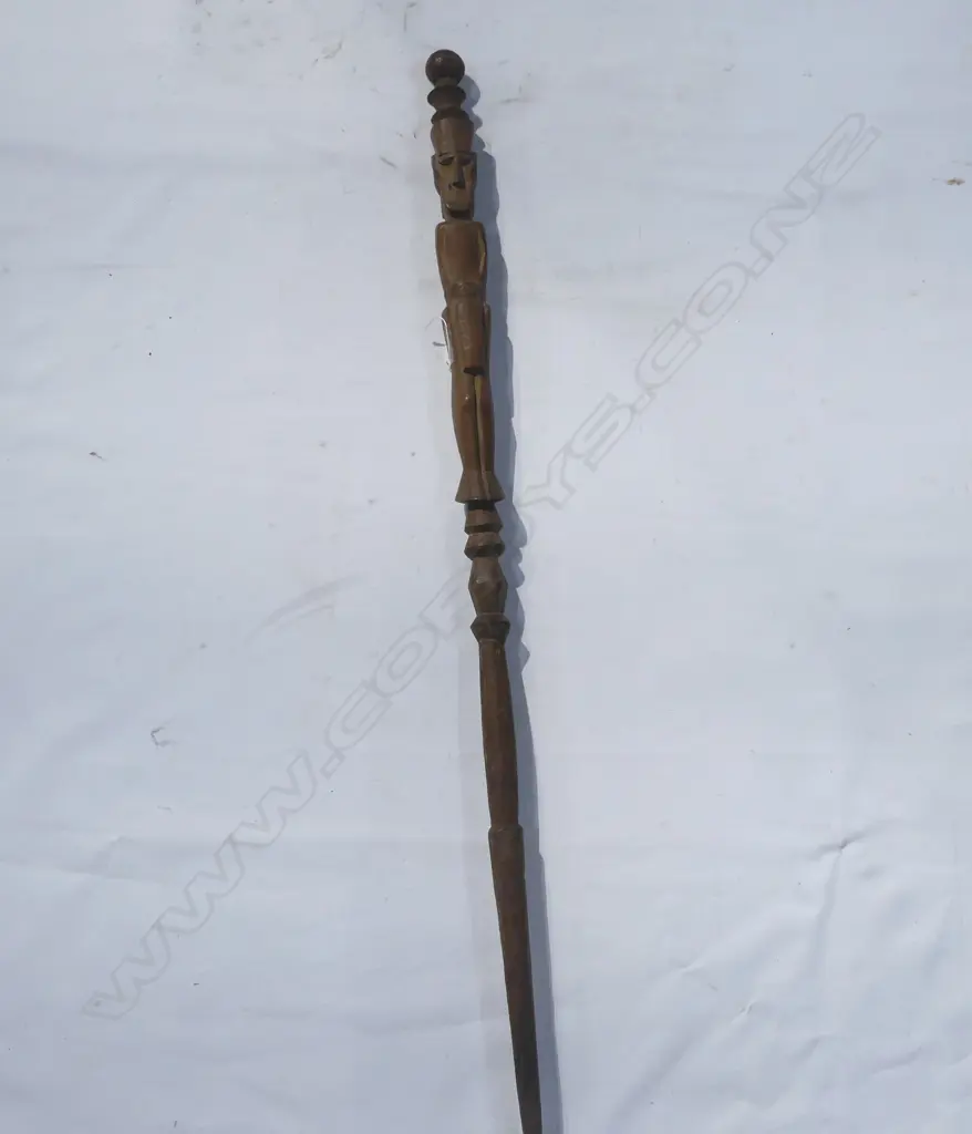 A wood carved tribal staff Image 1++