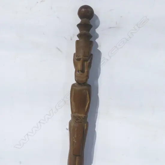 A wood carved tribal staff