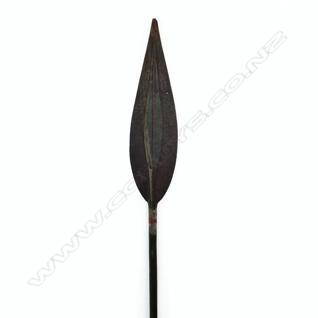 An old Trobriand Islands long paddle with carved and painted detail Image 1++