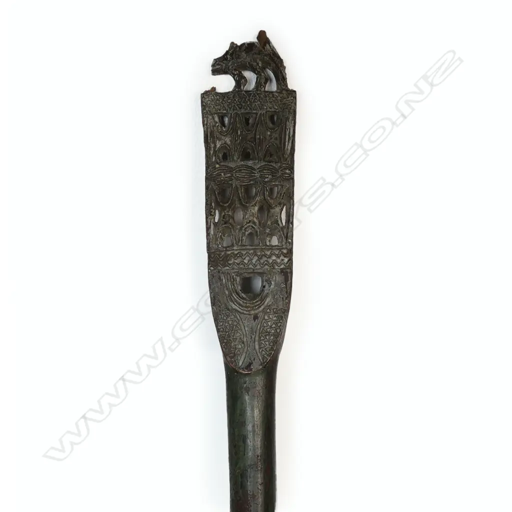 An old Trobriand Islands long paddle with carved and painted detail Image 1++