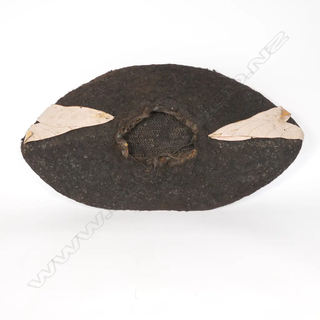 A human hair wig with dried leaf decoration Image 1++