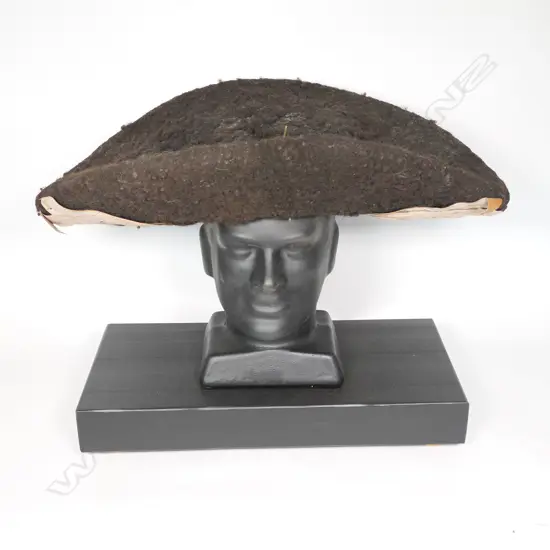 A human hair wig with dried leaf decoration