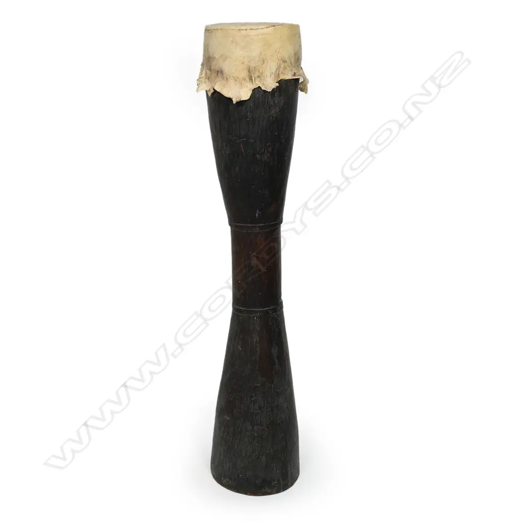 A vintage carved wood kundu drum from PNG Image 1++