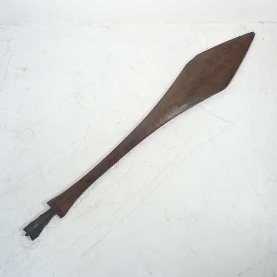 An old Indonesian carved wood paddle form spear