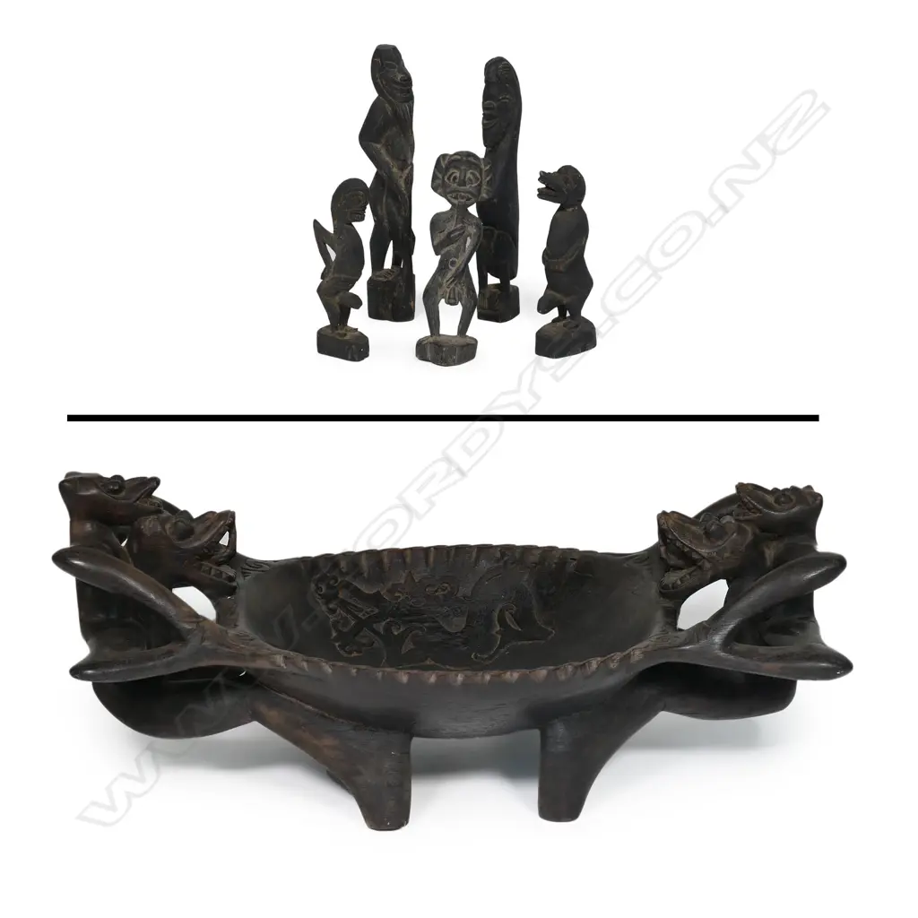 An Indonesian figure supported large wooden bowl with five small tribal figures Image 1++