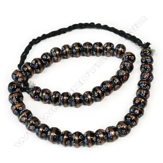 A long strand of coloured glass trade beads