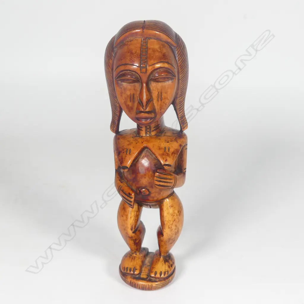 A Yoruba Benin Ere Ibeji solid ivory carved female figure Image 1++