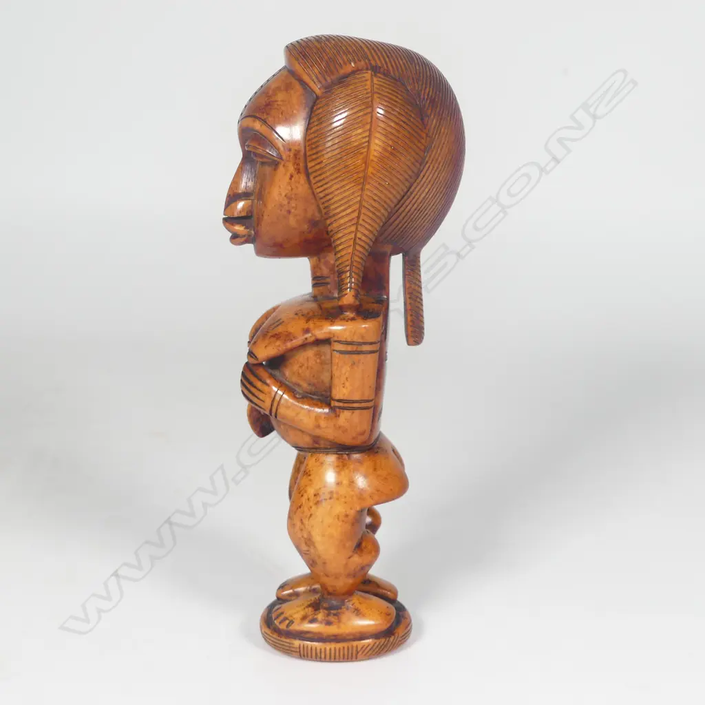 A Yoruba Benin Ere Ibeji solid ivory carved female figure Image 1++