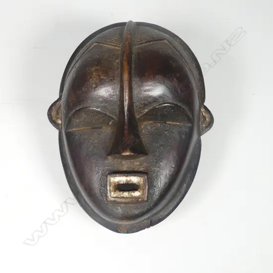 African carved wood Dan mask rectangular mouth