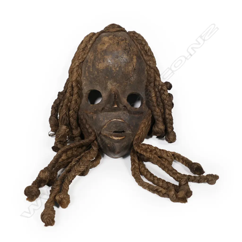 A carved Dan mask Image 1++