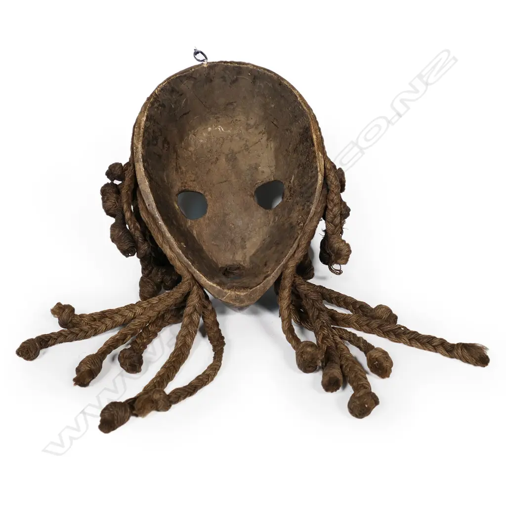 A carved Dan mask Image 1++