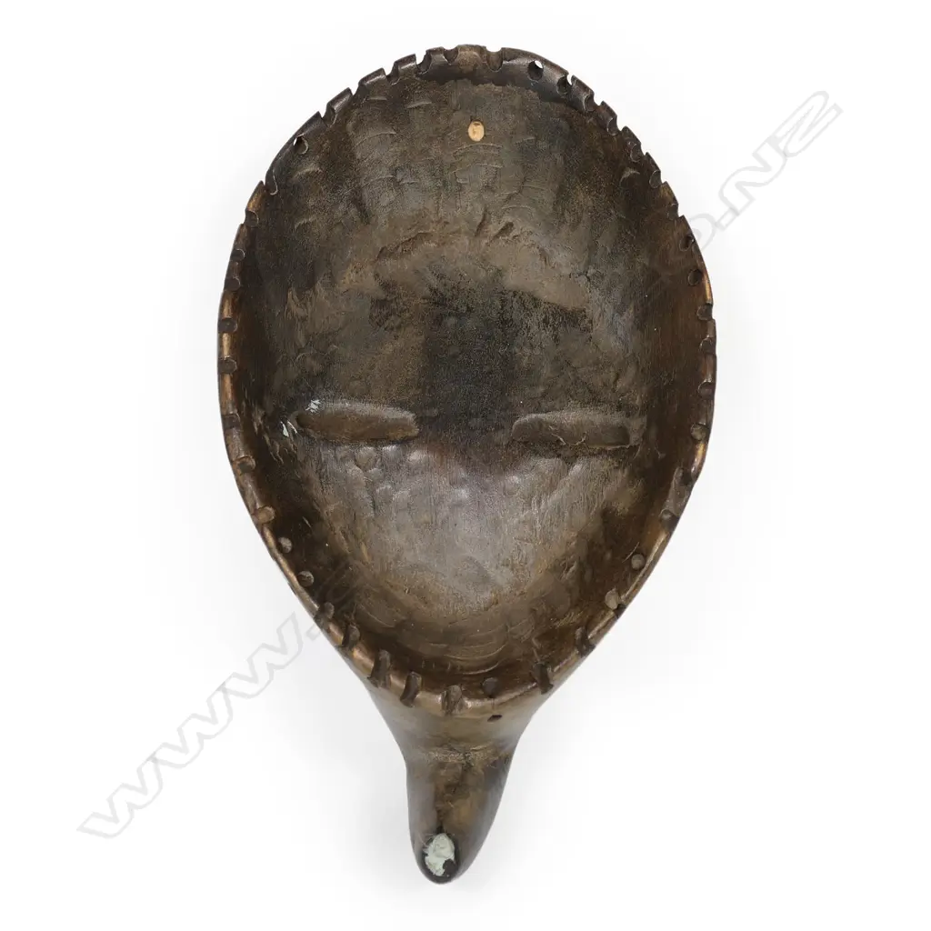 A carved Bird mask Image 1++